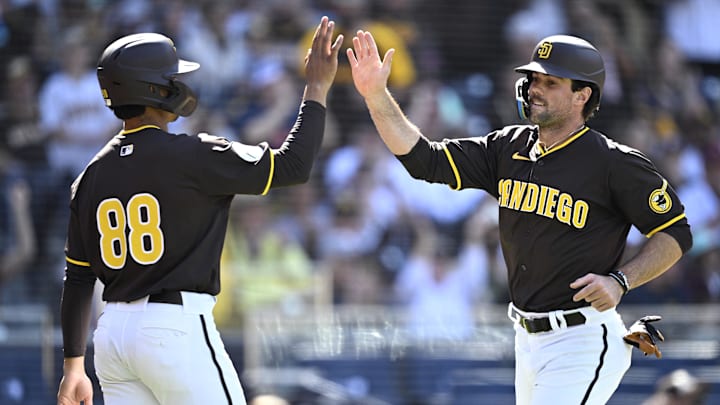 Mar 26, 2024; San Diego, California, USA; San Diego Padres catcher Ethan Salas (88) celebrates with third baseman Graham Pauley (right) after scoring runs against the Seattle Mariners during the seventh inning at Petco Park. Mandatory Credit: Orlando Ramirez-Imagn Images