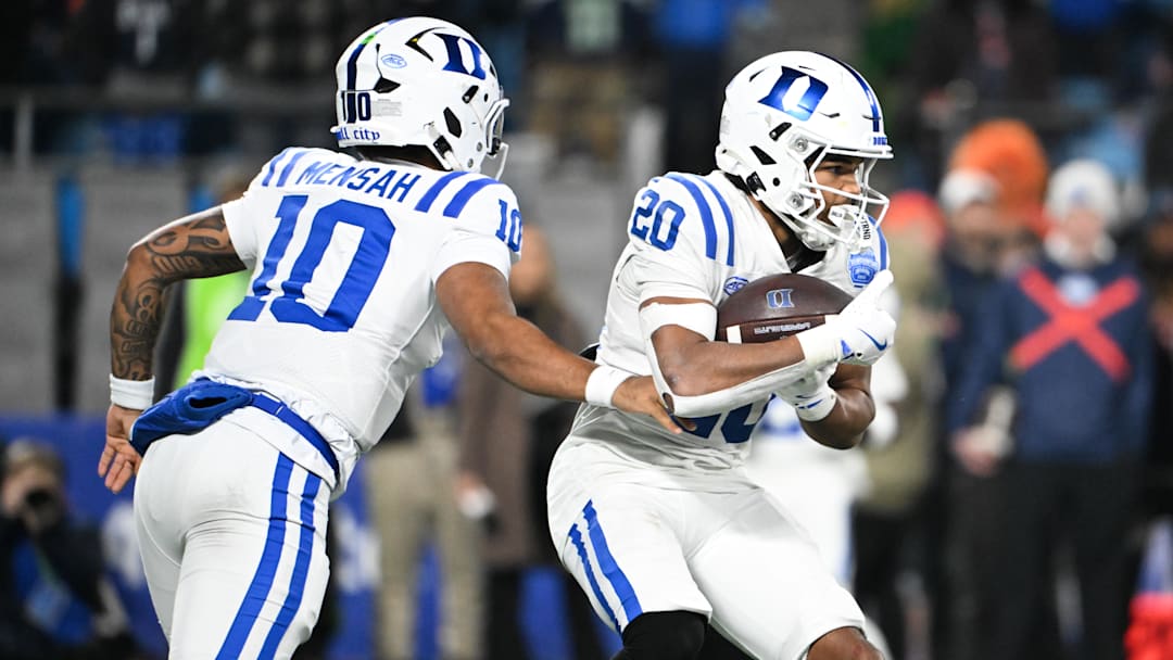 Dec 6, 2025; Charlotte, NC, USA; Duke Blue Devils running back Nate Sheppard (20) receives a hand off in the second quarter against the Virginia Cavaliers during the 2025 ACC Championship.