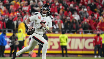 Jan 18, 2025; Kansas City, Missouri, USA; Houston Texans quarterback C.J. Stroud (7) rolls out to throw against the Kansas City Chiefs during the fourth quarter of a 2025 AFC divisional round game at GEHA Field at Arrowhead Stadium. Mandatory Credit: Denny Medley-Imagn Images