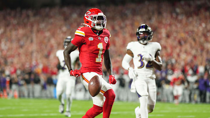 Sep 5, 2024; Kansas City, Missouri, USA; Kansas City Chiefs wide receiver Xavier Worthy (1) scores a touchdown against Baltimore Ravens safety Marcus Williams (32) during the first half at GEHA Field at Arrowhead Stadium.