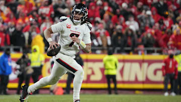 Jan 18, 2025; Kansas City, Missouri, USA; Houston Texans quarterback C.J. Stroud (7) rolls out to throw against the Kansas City Chiefs during the fourth quarter of a 2025 AFC divisional round game at GEHA Field at Arrowhead Stadium. Mandatory Credit: Denny Medley-Imagn Images