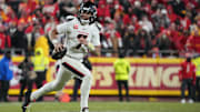 Jan 18, 2025; Kansas City, Missouri, USA; Houston Texans quarterback C.J. Stroud (7) rolls out to throw against the Kansas City Chiefs during the fourth quarter of a 2025 AFC divisional round game at GEHA Field at Arrowhead Stadium. Mandatory Credit: Denny Medley-Imagn Images