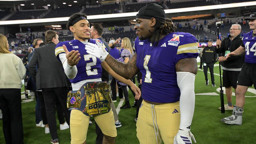 Dec 13, 2025; Inglewood, CA, USA; Washington Huskies quarterback Demond Williams Jr. (2) and Washington Huskies running back Jonah Coleman (1) celebrate after defeating the Boise State Broncos in the LA Bowl at SoFi Stadium. Mandatory Credit: Jayne Kamin-Oncea-Imagn Images Dec 13, 2025; Inglewood, CA, USA; Washington Huskies quarterback Demond Williams Jr. (2) and Washington Huskies running back Jonah Coleman (1) celebrate after defeating the Boise State Broncos in the LA Bowl at SoFi Stadium. Mandatory Credit: Jayne Kamin-Oncea-Imagn Images