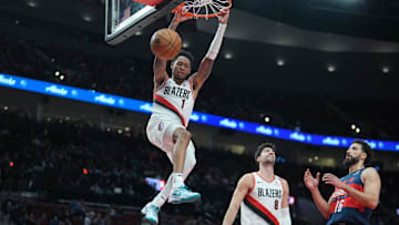 Mar 17, 2025; Portland, Oregon, USA; Portland Trail Blazers shooting guard Anfernee Simons (1) dunks the ball during the second half against the Washington Wizards at Moda Center. Mandatory Credit: Soobum Im-Imagn Images