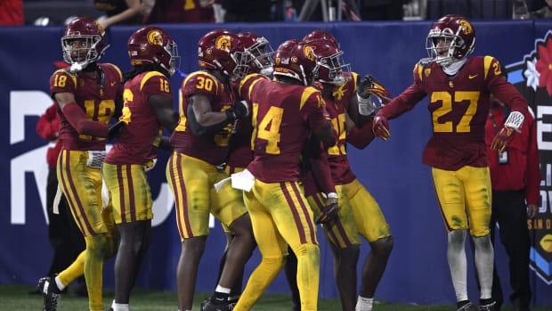 USC Trojans players celebrate after a turnover against the Louisville Cardinals during the second half at Petco Park.