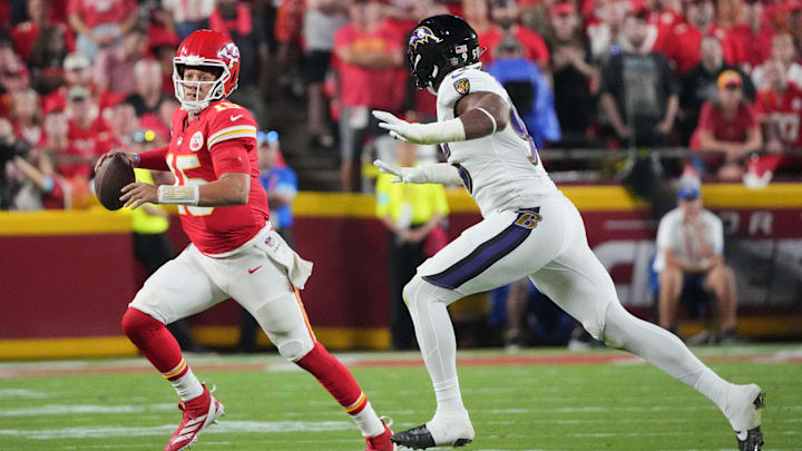 Sep 5, 2024; Kansas City, Missouri, USA; Kansas City Chiefs quarterback Patrick Mahomes (15) runs the ball as Baltimore Ravens linebacker Tavius Robinson (95) chases during the second half at GEHA Field at Arrowhead Stadium. Mandatory Credit: Denny Medley-Imagn Images