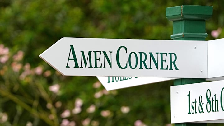 A sign showing the direction to Amen Corner at Augusta National Golf Course. A sign showing the direction to Amen Corner at Augusta National Golf Course.