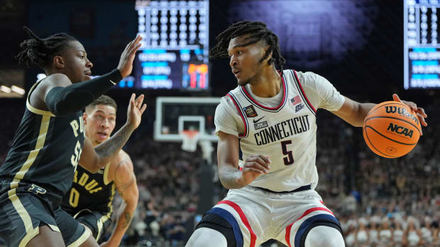 Apr 8, 2024; Glendale, AZ, USA; Connecticut Huskies guard Stephon Castle (5) dribbles the ball against Purdue Boilermakers guard Myles Colvin (5) during the first half of the national championship game of the Final Four of the 2024 NCAA Tournament at State Farm Stadium. Mandatory Credit: Bob Donnan-USA TODAY Sports