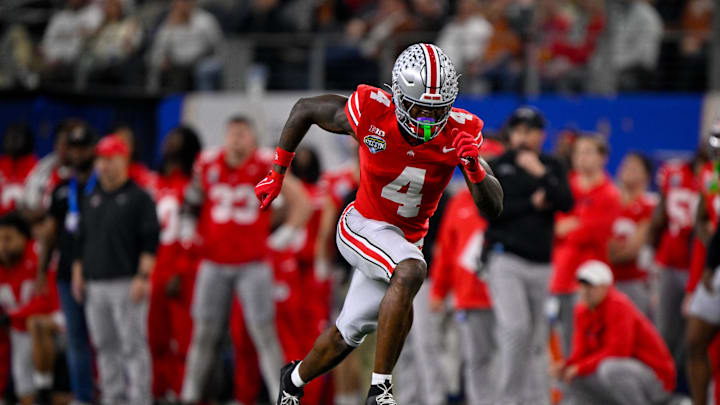 Jan 10, 2025; Arlington, TX, USA; Ohio State Buckeyes wide receiver Jeremiah Smith (4) in action during the game between the Texas Longhorns and the Ohio State Buckeyes at AT&T Stadium. Mandatory Credit: Jerome Miron-Imagn Images