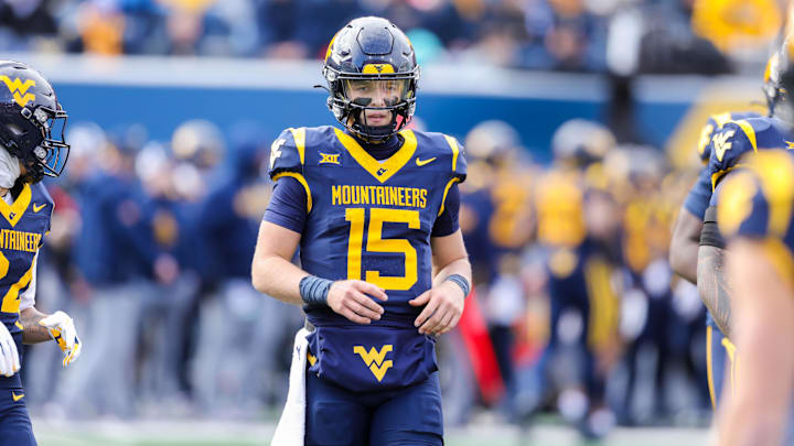 Nov 29, 2025; Morgantown, West Virginia, USA; West Virginia Mountaineers quarterback Scotty Fox Jr. (15) on the field during the second quarter against the Texas Tech Red Raiders at Milan Puskar Stadium. Mandatory Credit: Ben Queen-Imagn Images