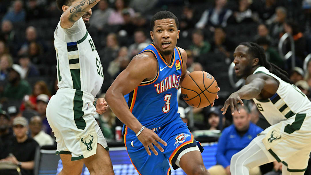Oct 14, 2025; Milwaukee, Wisconsin, USA; Oklahoma City Thunder guard Chris Youngblood (3) drives the ball against the Milwaukee Bucks during the second half at Fiserv Forum. Mandatory Credit: Patrick Gorski-Imagn Images