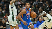 Oct 14, 2025; Milwaukee, Wisconsin, USA; Oklahoma City Thunder guard Chris Youngblood (3) drives the ball against the Milwaukee Bucks during the second half at Fiserv Forum. Mandatory Credit: Patrick Gorski-Imagn Images
