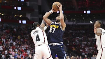 Mar 23, 2025; Houston, Texas, USA; Denver Nuggets guard Jamal Murray (27) attempts to shoot the ball as Houston Rockets guard Jalen Green (4) defends during the fourth quarter at Toyota Center. Mandatory Credit: Troy Taormina-Imagn Images