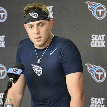May 10, 2025; Nashville, TN, USA;  Tennessee Titans tight end Gunnar Helm (84) talks with reporters after his first day of rookie mini camp at Saint Thomas Sports Park. Mandatory Credit: Steve Roberts-Imagn Images