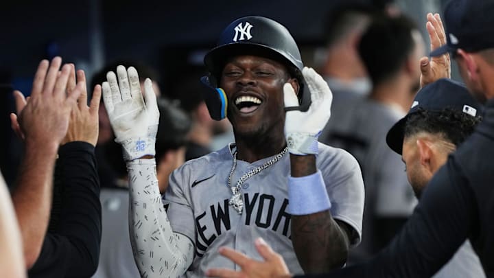 Jun 30, 2025; Toronto, Ontario, CAN; New York Yankees third baseman Jazz Chisholm Jr. (13) celebrates in the dugout after hitting a two-run home run against the Toronto Blue Jays during the fourth inning at Rogers Centre. Mandatory Credit: Nick Turchiaro-Imagn Images