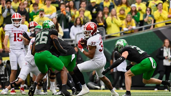 Oct 11, 2025; Eugene, Oregon, USA; Indiana Hoosiers tight end Riley Nowakowski (37) runs with the ball against Oregon Ducks linebacker Devon Jackson (26) and defensive back Dillon Thieneman (31) during the first quarter at Autzen Stadium. Mandatory Credit: Troy Wayrynen-Imagn Images