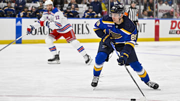 Jan 11, 2024; St. Louis, Missouri, USA;  St. Louis Blues left wing Pavel Buchnevich (89) controls the puck against the New York Rangers during the second period at Enterprise Center. Mandatory Credit: Jeff Curry-Imagn Images