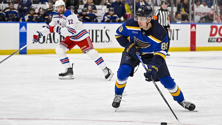 Jan 11, 2024; St. Louis, Missouri, USA;  St. Louis Blues left wing Pavel Buchnevich (89) controls the puck against the New York Rangers during the second period at Enterprise Center. Mandatory Credit: Jeff Curry-Imagn Images