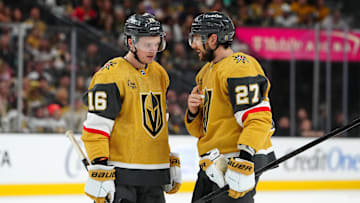 Apr 12, 2025; Las Vegas, Nevada, USA; Vegas Golden Knights left wing Pavel Dorofeyev (16) talks with Vegas Golden Knights defenseman Shea Theodore (27) before a face off against the Nashville Predators during the first period at T-Mobile Arena. Mandatory Credit: Stephen R. Sylvanie-Imagn Images