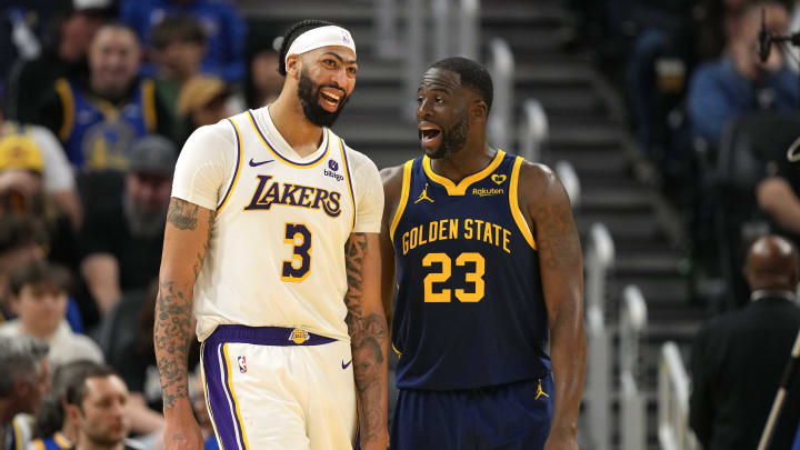 Jan 27, 2024; San Francisco, California, USA; Los Angeles Lakers forward Anthony Davis (3) and Golden State Warriors forward Draymond Green (23) talk during the third quarter at Chase Center.