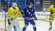 Aug 2, 2024; Plymouth, MI, USA; USA’s forward Teddy Stiga (9) sets up in front of Sweden's goaltender Melker Thelin (35) during the third period of the 2024 World Junior Summer Showcase at USA Hockey Arena. Mandatory Credit: David Reginek-Imagn Images