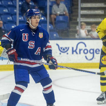 Aug 2, 2024; Plymouth, MI, USA; USA’s forward Teddy Stiga (9) sets up in front of Sweden's goaltender Melker Thelin (35) during the third period of the 2024 World Junior Summer Showcase at USA Hockey Arena. Mandatory Credit: David Reginek-Imagn Images