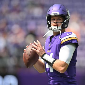 Aug 10, 2024; Minneapolis, Minnesota, USA; Minnesota Vikings quarterback Sam Darnold (14) warms up before the game against the Las Vegas Raiders at U.S. Bank Stadium. Mandatory Credit: Jeffrey Becker-USA TODAY Sports