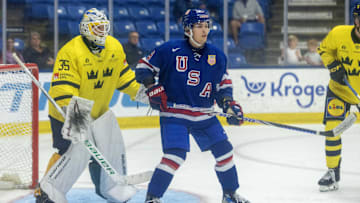 Aug 2, 2024; Plymouth, MI, USA; USA’s forward Teddy Stiga (9) sets up in front of Sweden's goaltender Melker Thelin (35) during the third period of the 2024 World Junior Summer Showcase at USA Hockey Arena. Mandatory Credit: David Reginek-Imagn Images