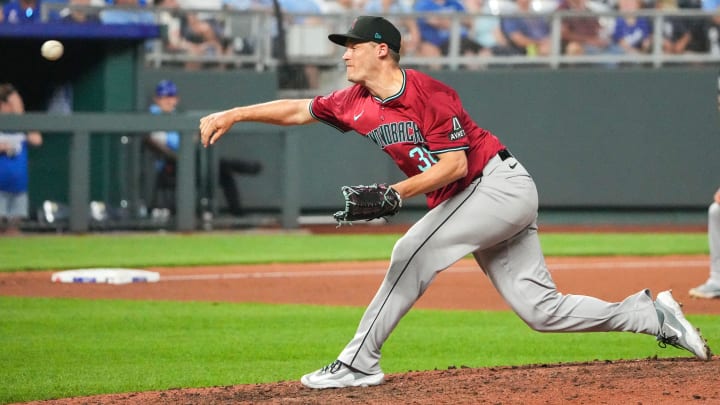 Jul 24, 2024; Kansas City, Missouri, USA; Arizona Diamondbacks pitcher Paul Sewald (38) delivers a pitch against the Kansas City Royals in the ninth inning at Kauffman Stadium. Mandatory Credit: Denny Medley-USA TODAY Sports