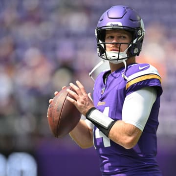 Aug 10, 2024; Minneapolis, Minnesota, USA; Minnesota Vikings quarterback Sam Darnold (14) warms up before the game against the Las Vegas Raiders at U.S. Bank Stadium.