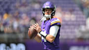 Aug 10, 2024; Minneapolis, Minnesota, USA; Minnesota Vikings quarterback Sam Darnold (14) warms up before the game against the Las Vegas Raiders at U.S. Bank Stadium. Mandatory Credit: Jeffrey Becker-Imagn Images