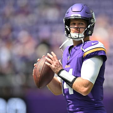 Aug 10, 2024; Minneapolis, Minnesota, USA; Minnesota Vikings quarterback Sam Darnold (14) warms up before the game against the Las Vegas Raiders at U.S. Bank Stadium. Mandatory Credit: Jeffrey Becker-Imagn Images