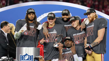 Jan 28, 2024; Santa Clara, California, USA; (Left to right) San Francisco 49ers celebrate winning the NFC Championship. 