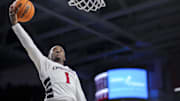 Dec 22, 2024; Cincinnati, Ohio, USA;  Cincinnati Bearcats guard Day Day Thomas (1) drives to the basket against the Grambling State Tigers in the second half at Fifth Third Arena. Mandatory Credit: Aaron Doster-Imagn Images