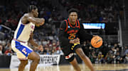 Mar 27, 2025; San Francisco, CA, USA; Maryland Terrapins center Derik Queen (25) dribbles down court past Florida Gators center Rueben Chinyelu (9) during the second half during a West Regional semifinal of the 2025 NCAA tournament at Chase Center. Mandatory Credit: Eakin Howard-Imagn Images
