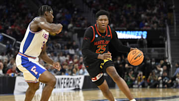 Mar 27, 2025; San Francisco, CA, USA; Maryland Terrapins center Derik Queen (25) dribbles down court past Florida Gators center Rueben Chinyelu (9) during the second half during a West Regional semifinal of the 2025 NCAA tournament at Chase Center. Mandatory Credit: Eakin Howard-Imagn Images