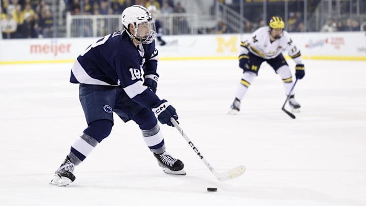 Mar 7, 2025; Ann Arbor, MI, USA; Penn State forward Aiden Fink (18) skates with the puck in the second period against Michigan during a Big Ten Tournament quarter final game at Yost Arena. Mandatory Credit: Rick Osentoski-Imagn Images Mar 7, 2025; Ann Arbor, MI, USA; Penn State forward Aiden Fink (18) skates with the puck in the second period against Michigan during a Big Ten Tournament quarter final game at Yost Arena. Mandatory Credit: Rick Osentoski-Imagn Images