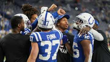 Indianapolis Colts players including Indianapolis Colts running back Jonathan Taylor (28) huddle up