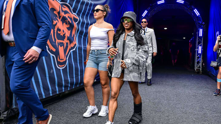 United States gymnast Simone Biles enters the field before the game between the Chicago Bears and the Cincinnati Bengals at Soldier Field. 