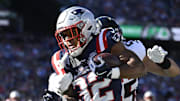 Nov 2, 2025; Foxborough, Massachusetts, USA; New England Patriots running back TreVeyon Henderson (32) runs the ball against the Atlanta Falcons during the first quarter at Gillette Stadium. Mandatory Credit: Eric Canha-Imagn Images