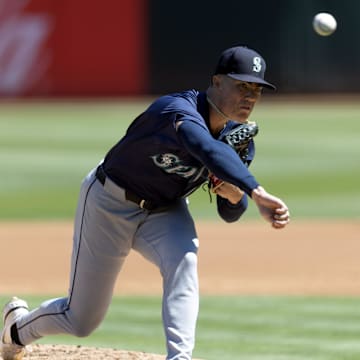 Seattle Mariners starting pitcher Bryan Woo throws against the Oakland Athletics during a game Monday at Oakland Coliseum.