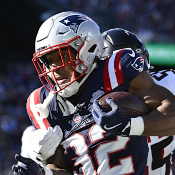 Nov 2, 2025; Foxborough, Massachusetts, USA; New England Patriots running back TreVeyon Henderson (32) runs the ball against the Atlanta Falcons during the first quarter at Gillette Stadium. Mandatory Credit: Eric Canha-Imagn Images