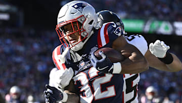 Nov 2, 2025; Foxborough, Massachusetts, USA; New England Patriots running back TreVeyon Henderson (32) runs the ball against the Atlanta Falcons during the first quarter at Gillette Stadium. 
