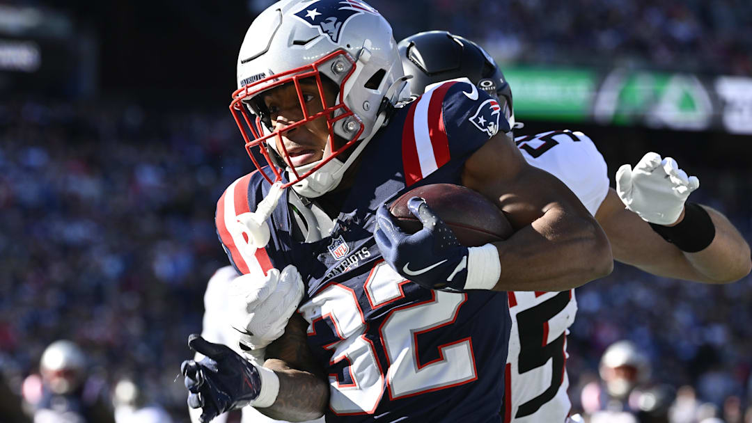 Nov 2, 2025; Foxborough, Massachusetts, USA; New England Patriots running back TreVeyon Henderson (32) runs the ball against the Atlanta Falcons during the first quarter at Gillette Stadium. Mandatory Credit: Eric Canha-Imagn Images