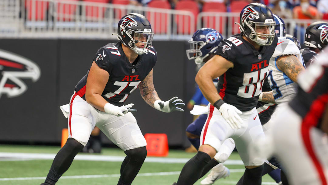 Aug 13, 2021; Atlanta, Georgia, USA; Atlanta Falcons offensive tackle Jalen Mayfield (77) blocks during their game against the Tennessee Titans at Mercedes-Benz Stadium. Mandatory Credit: Jason Getz-Imagn Images