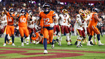 Nov 30, 2025; Landover, Maryland, USA; Denver Broncos running back RJ Harvey (12) celebrates after scoring a touchdown against the Washington Commanders in overtime of the game at Northwest Stadium. Mandatory Credit: Peter Casey-Imagn Images