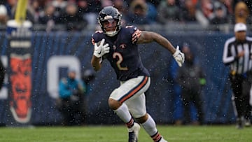 Dec 31, 2023; Chicago, Illinois, USA;  Chicago Bears wide receiver DJ Moore (2) runs with the ball against the Atlanta Falcons at Soldier Field. Mandatory Credit: Jamie Sabau-Imagn Images
