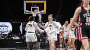 Mar 7, 2025; Kansas City, MO, USA; Oklahoma State Cowgirls guard Alexia Smith (25) and guard Anna Gret Asi (4) celebrate after defeating the Texas Tech Lady Raiders at T-Mobile Center. Mandatory Credit: Amy Kontras-Imagn Images