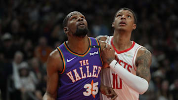 Mar 30, 2025; Phoenix, Arizona, USA; Phoenix Suns forward Kevin Durant (35) and Houston Rockets forward Jabari Smith Jr. (10) fight for position in the first half at Footprint Center. Mandatory Credit: Rick Scuteri-Imagn Images