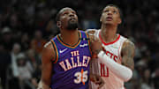 Mar 30, 2025; Phoenix, Arizona, USA; Phoenix Suns forward Kevin Durant (35) and Houston Rockets forward Jabari Smith Jr. (10) fight for position in the first half at Footprint Center. Mandatory Credit: Rick Scuteri-Imagn Images
